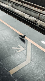 Low section of man walking on street