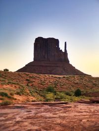 Low angle view of rock formation against clear sky