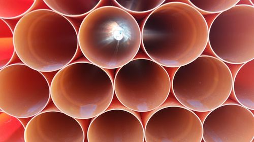 Full frame shot of orange drinking straws