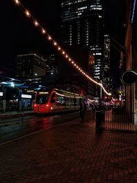 Illuminated buildings in city at night