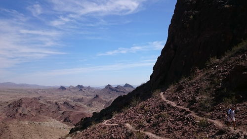 Scenic view of mountains against cloudy sky