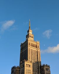 Low angle view of building against blue sky