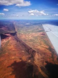 Aerial view of sea and landscape against sky