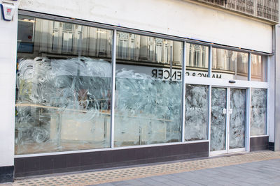 Reflection of building on train window