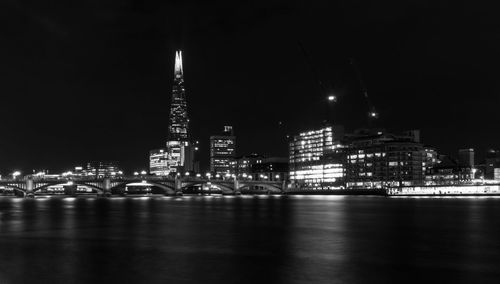 Illuminated buildings in city at night