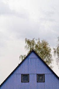 High section of building against cloudy sky