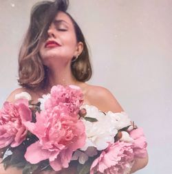 Beautiful woman with pink flower