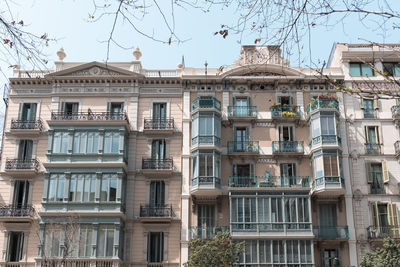 Classic apartment building with balconies and shutters in barcelona