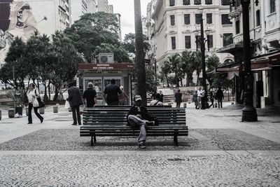 People sitting on bench in park