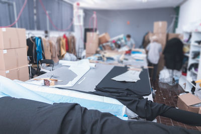 Clothing manufacturing facility with fabric on table