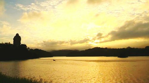 Scenic view of lake against sky during sunset