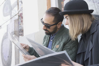 Young couple looking at records