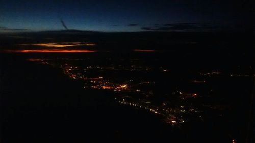Illuminated cityscape at night