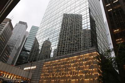 Low angle view of modern buildings against sky in city