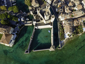 Aerial view  scaligero castle, an ancient fortress along sirmione coastal, lombardy, italy.