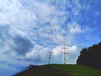 Low angle view of electricity pylon against sky