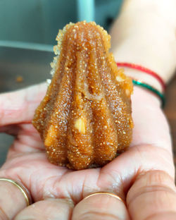 Close-up of hand holding fruit