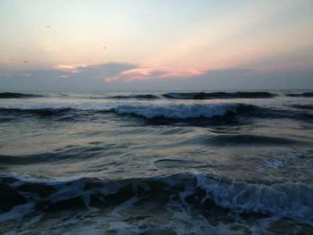 Scenic view of sea at sunset