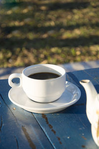 Close-up of coffee cup on table