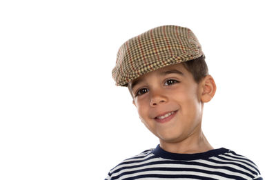 Portrait of smiling boy against white background