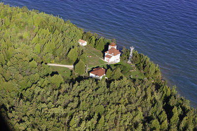 High angle view of trees by building