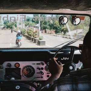 Close-up of man driving car