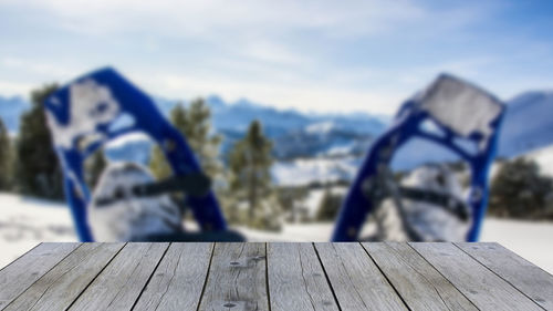Close-up of wooden post on pier against sky