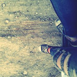 Low section of person standing on land