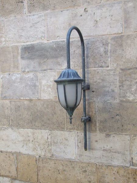 CLOSE-UP OF LAMP AGAINST WALL