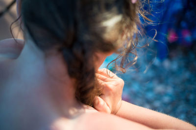 Close-up portrait of girl in water