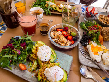 Amazing healthy brunch. avocado toast, açai bowl, poached eggs and smoothie