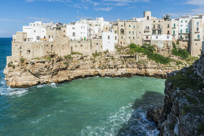 View of buildings by sea