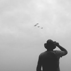 Low angle view of planes flying in sky