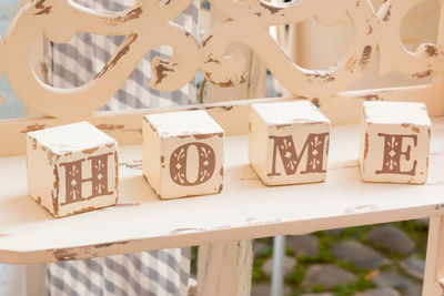 Close-up of block toys with text on table