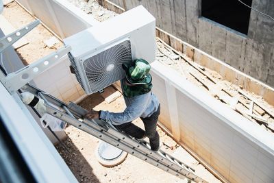 High angle view of man working at window