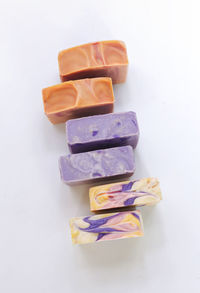 Close-up of multi colored pencils on white background