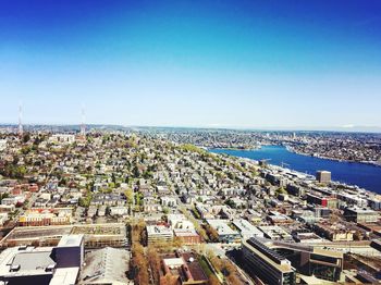 View of cityscape against clear blue sky