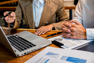 People using laptop on table