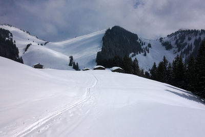 Scenic view of snow covered mountains