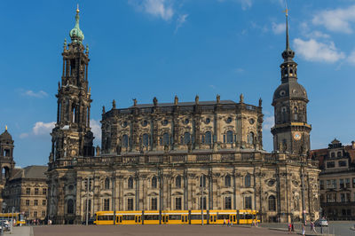 Facade of historic building against sky in city