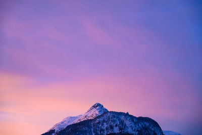 Scenic view of mountain against sky at sunset