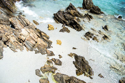 High angle view of rocks on shore