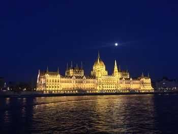 Illuminated buildings at waterfront