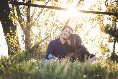 Portrait of smiling man lying in grass