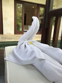 Close-up of human hand on window at home
