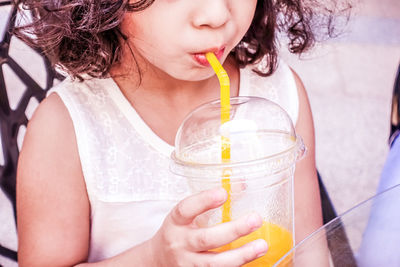 Close-up of girl having drink