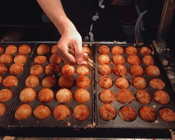 High angle view of person preparing food for sale at market