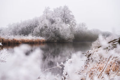 Scenic view of frozen lake against sky