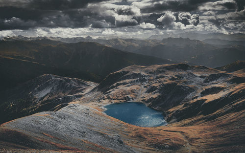 Aerial view of snowcapped mountains against sky