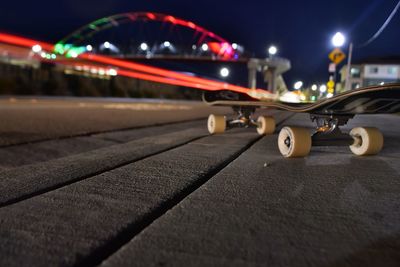 Cars on illuminated street at night